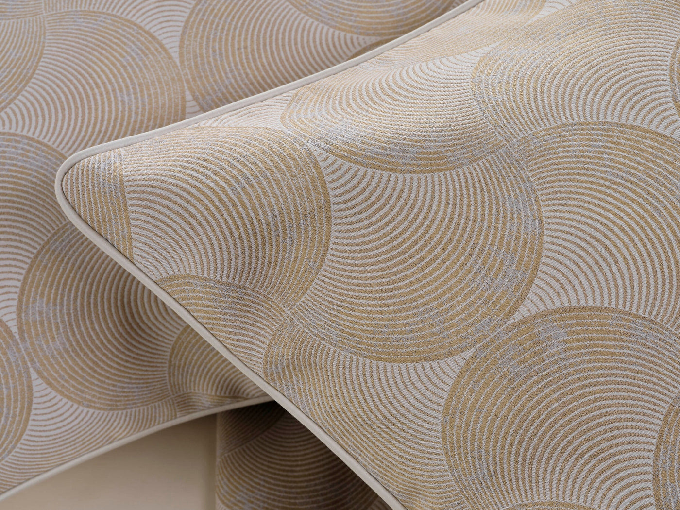 Close-up of two champagne and cream patterned pillow covers, featuring Caviar Pillow Cover by Celso de Lemos available at Linen Society.