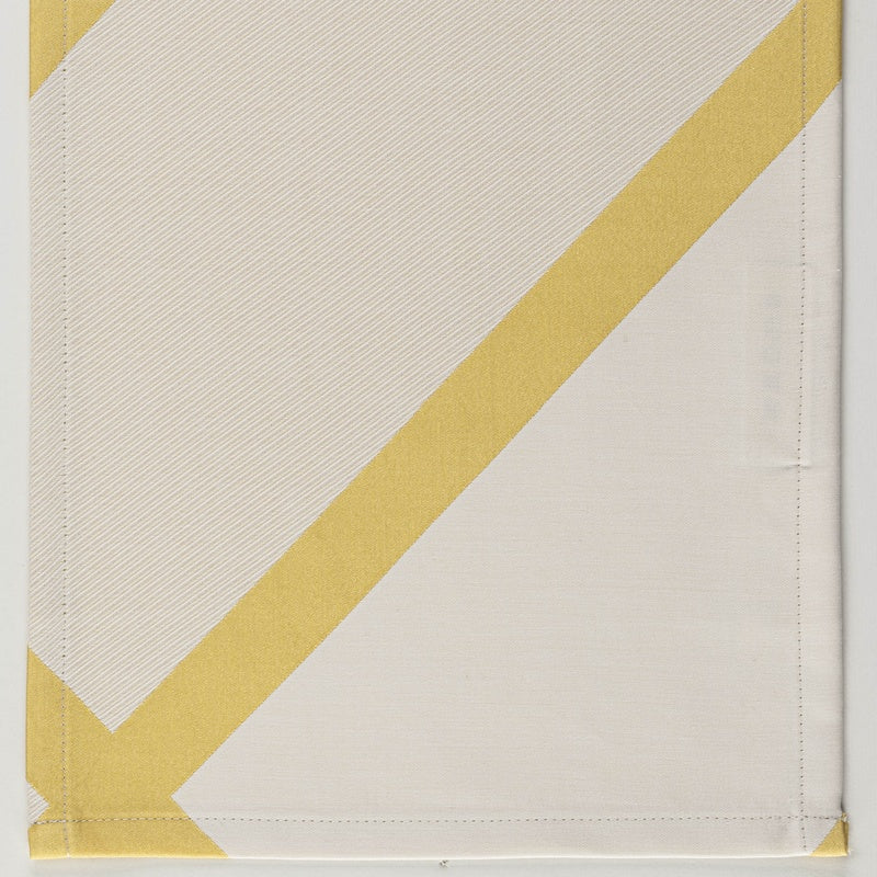Close-up of Charleston duvet cover corner with diagonal buttercup stripe on ivory linen.