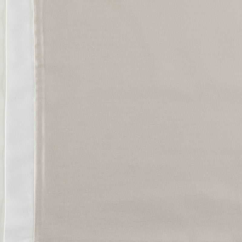Close-up of taupe sateen pillowcase with ivory contrast border detail.