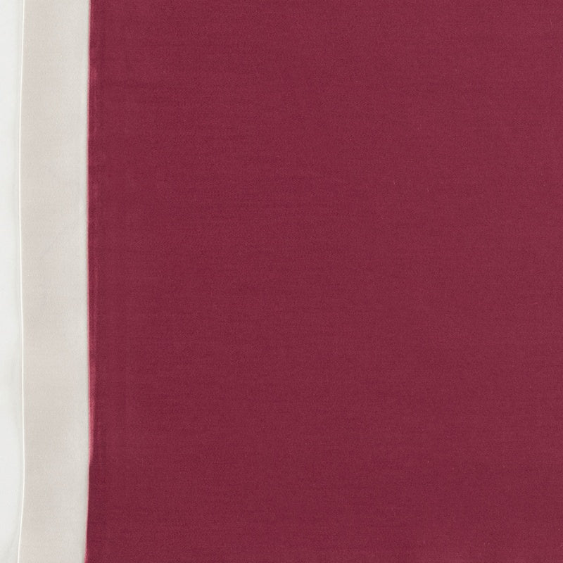 A textured maroon fabric with a cream border, featuring Emma Pillowcase by Celso de Lemos available at Linen Society.