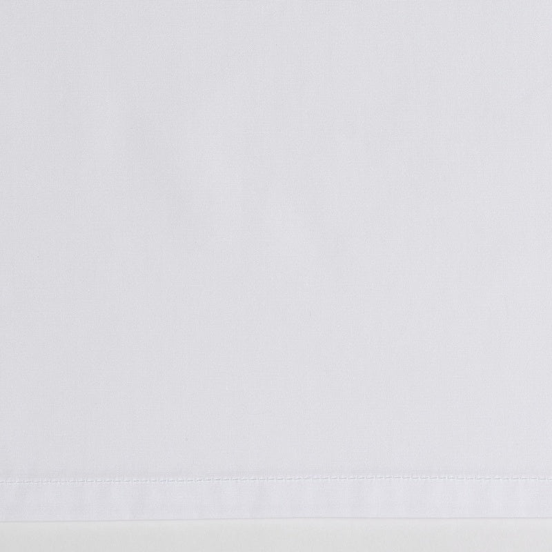 White textured fabric, a close-up of the hem detail, featuring Estrela Pillowcase by Celso de Lemos available at Linen Society.