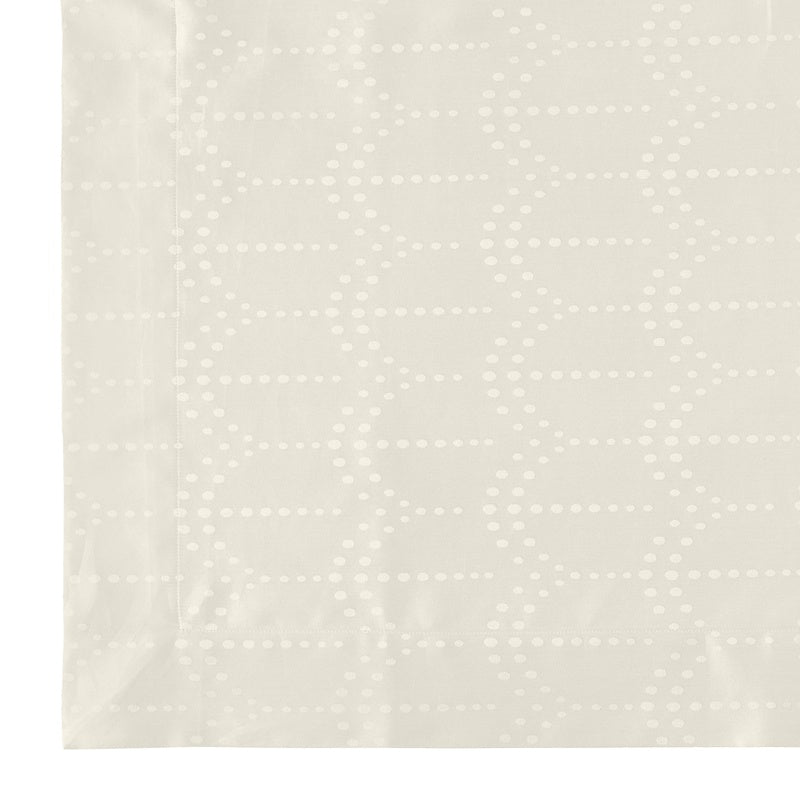 Close-up view of a light beige fabric with a subtle dotted pattern forming diamond shapes, featuring Evora Pillowcase by Celso de Lemos available at Linen Society.