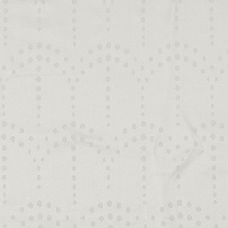 A close-up view of a textured white fabric with a repeating pattern of grey dots forming vertical lines and scattered clusters, featuring Evora Pillowcase by Celso de Lemos available at Linen Society.