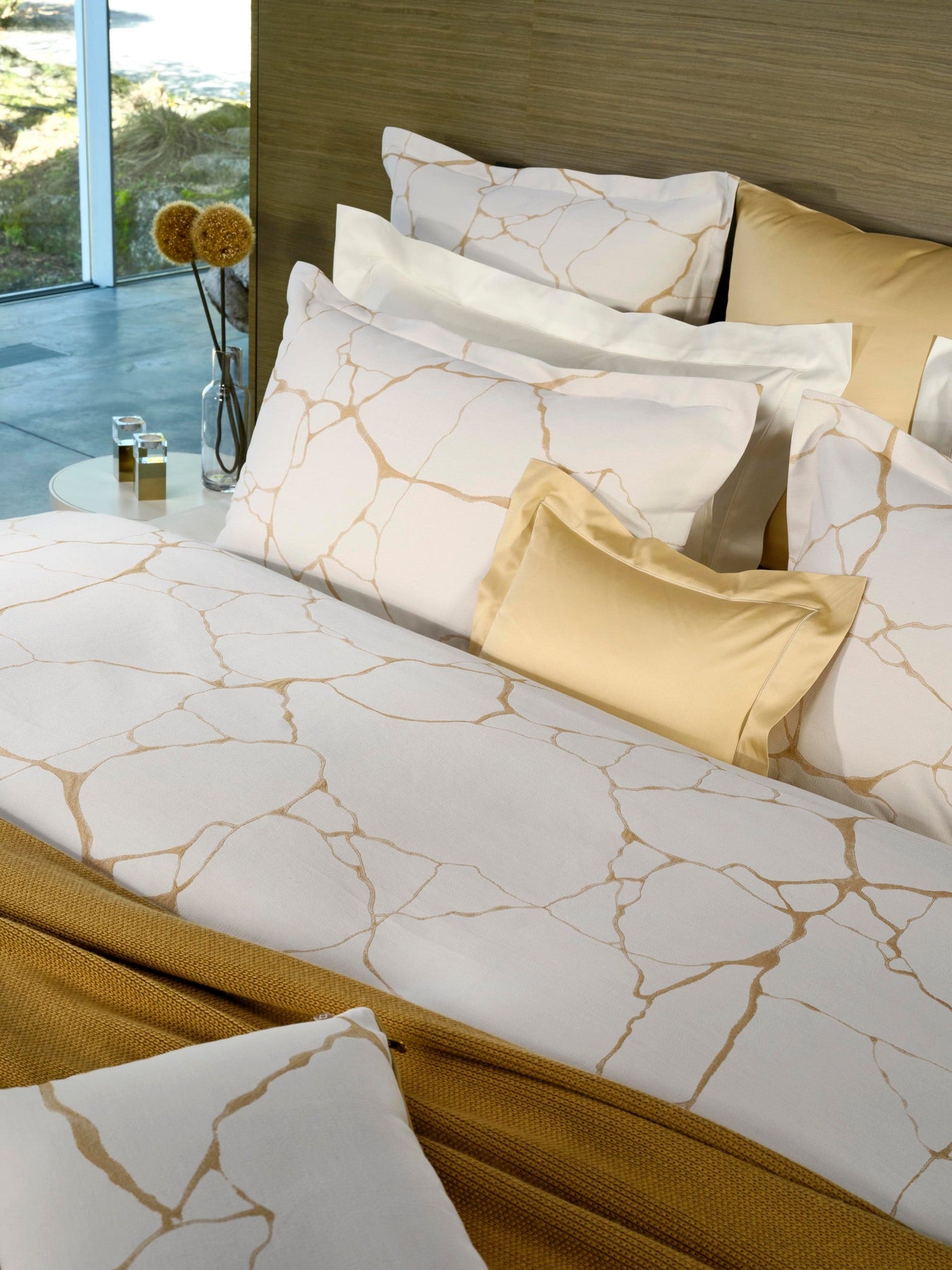 White duvet cover with gold abstract line pattern, featuring Jessie Pillowcase by Celso de Lemos available at Linen Society.