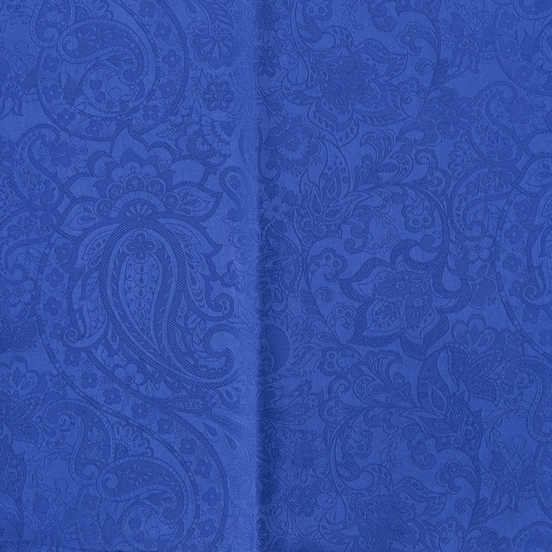 Blue fabric with a raised paisley pattern, featuring Joanne Pillowcase by Celso de Lemos available at Linen Society.