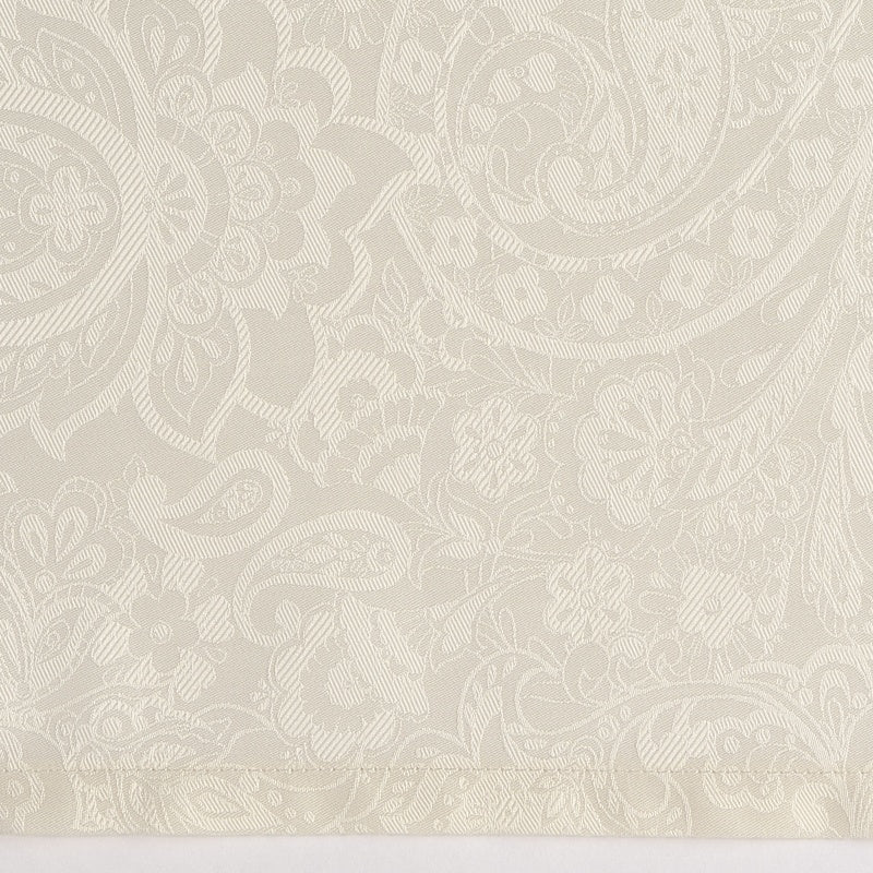 Close-up of a textured, jacquard woven cream fabric with an ornate paisley and floral damask pattern, featuring Joanne Pillowcase by Celso de Lemos available at Linen Society.