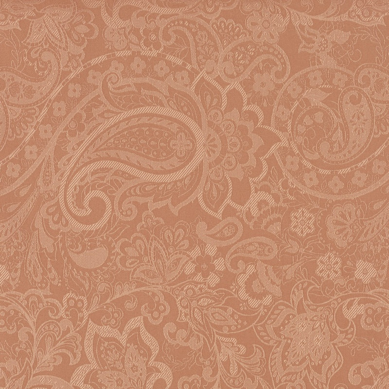 A close-up view of an intricately patterned, rust-colored fabric featuring a detailed paisley design, featuring Joanne Pillowcase by Celso de Lemos available at Linen Society.