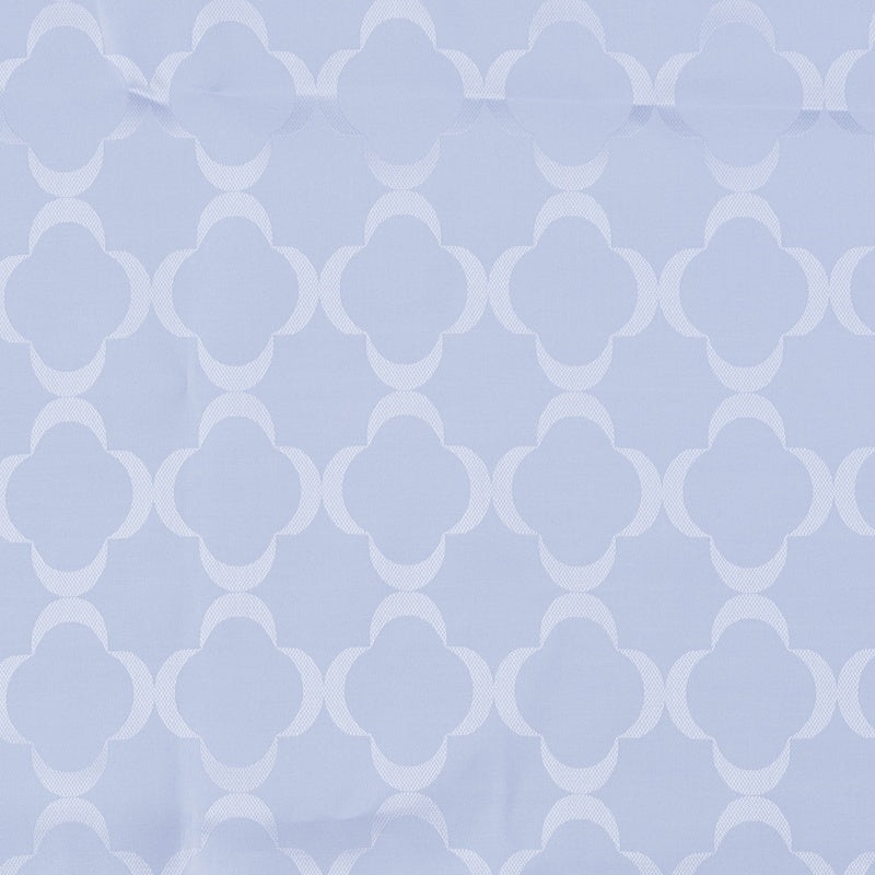 Close-up of light blue fabric with a repeating clover pattern and subtle texture, featuring Lua Pillowcase by Celso de Lemos available at Linen Society.