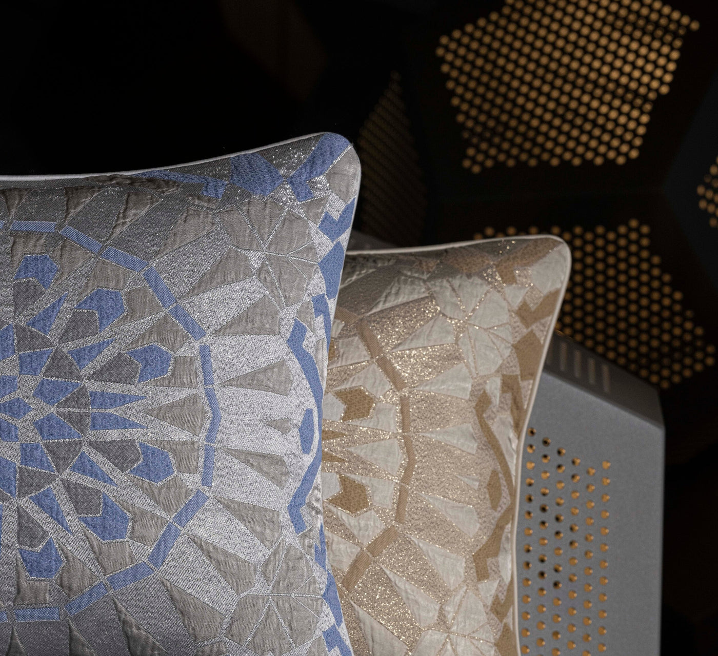 Two textured pillows with geometric patterns in blue and beige, featuring the Milena Pillow Cover by Celso de Lemos available at Linen Society.