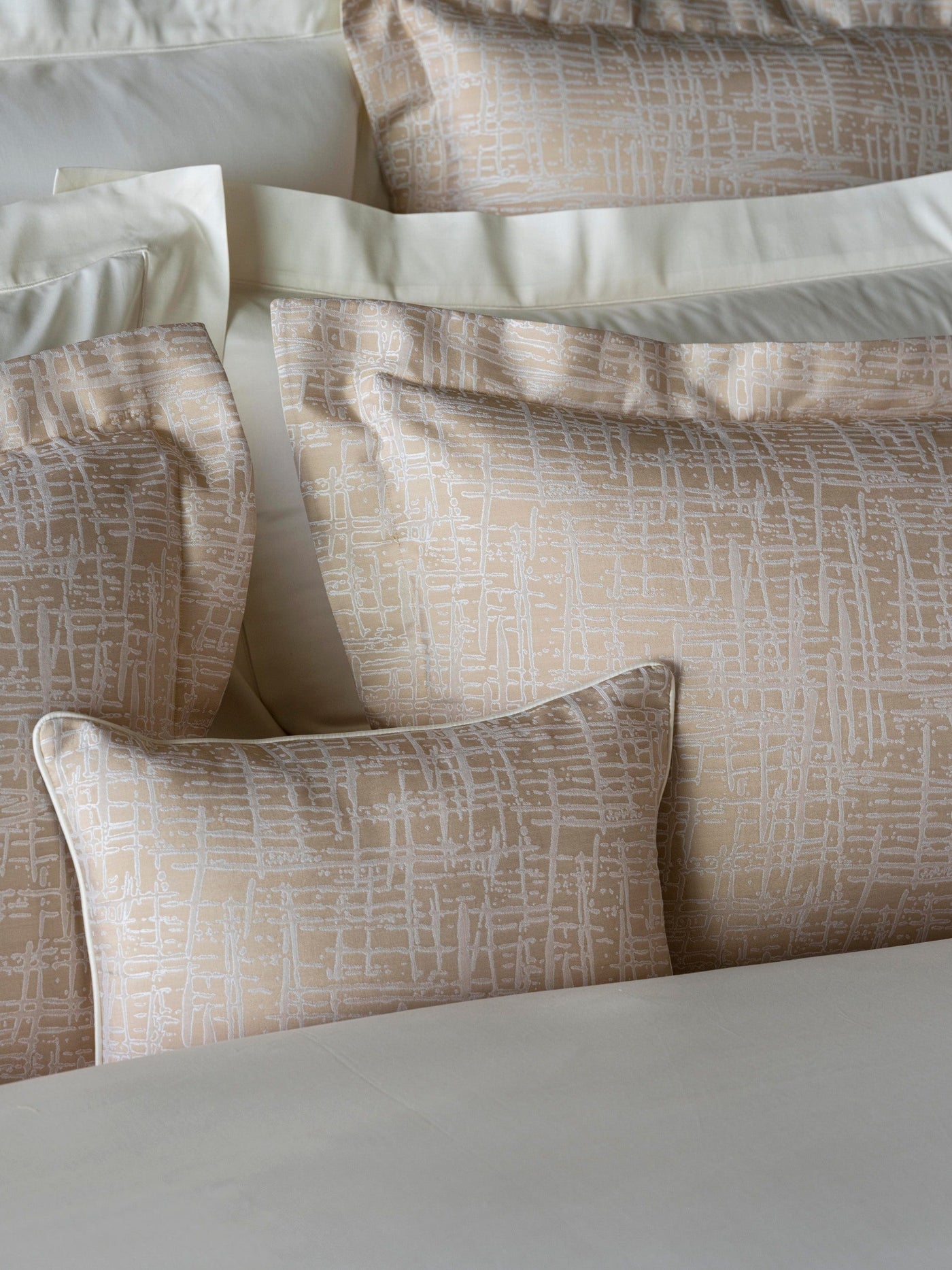 Celso de Lemos Partition pillowcase in champagne with silver crosshatch jacquard pattern.