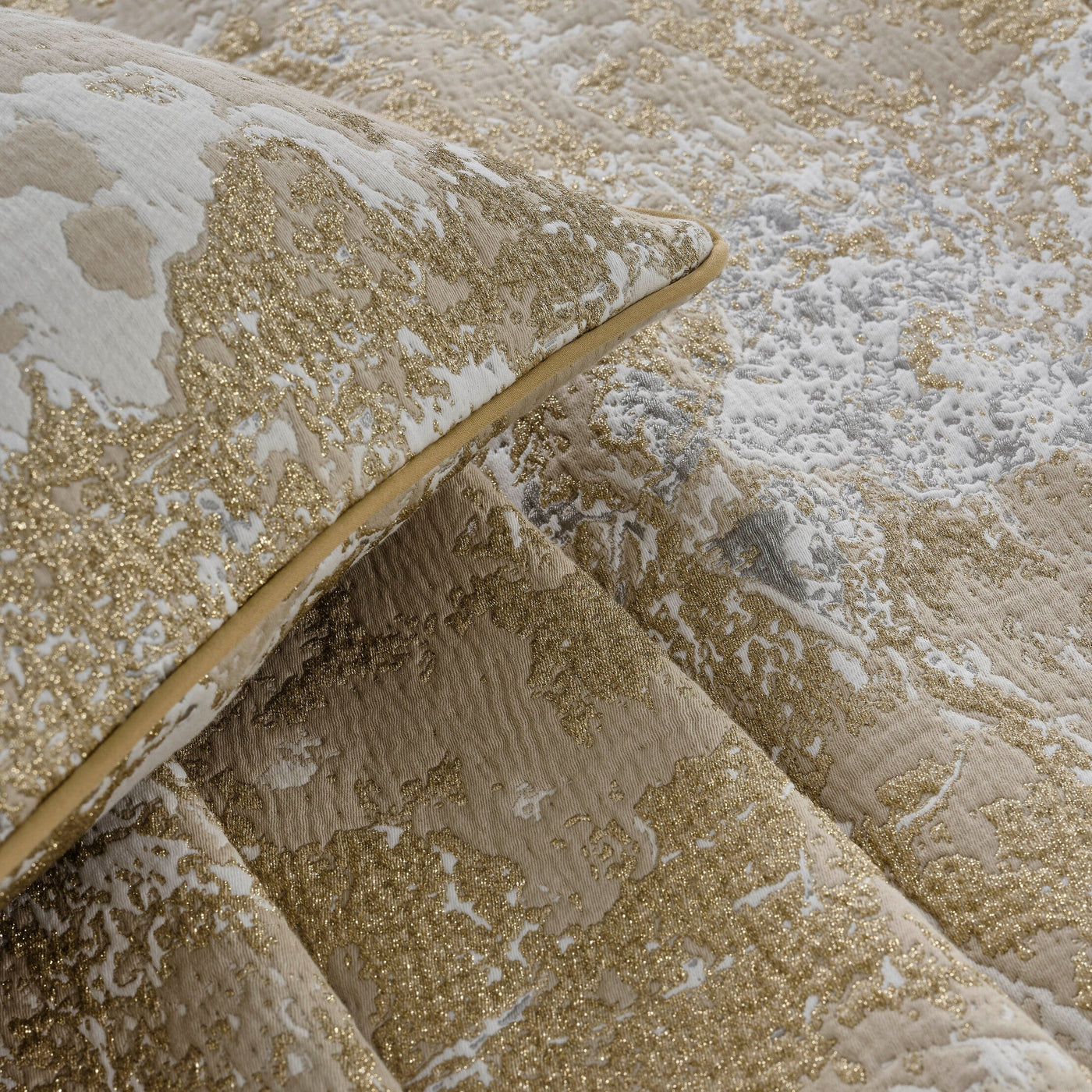 Close-up of textured fabric with gold and beige colors