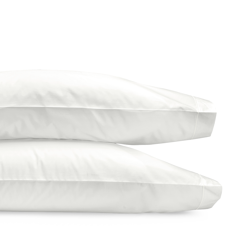Matouk Ceylon ivory sateen pillowcase set with satin stitch border, stacked pair.