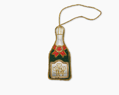 Henry Handwork embroidered champagne bottle ornament in forest green, ivory, and red with gold trim.