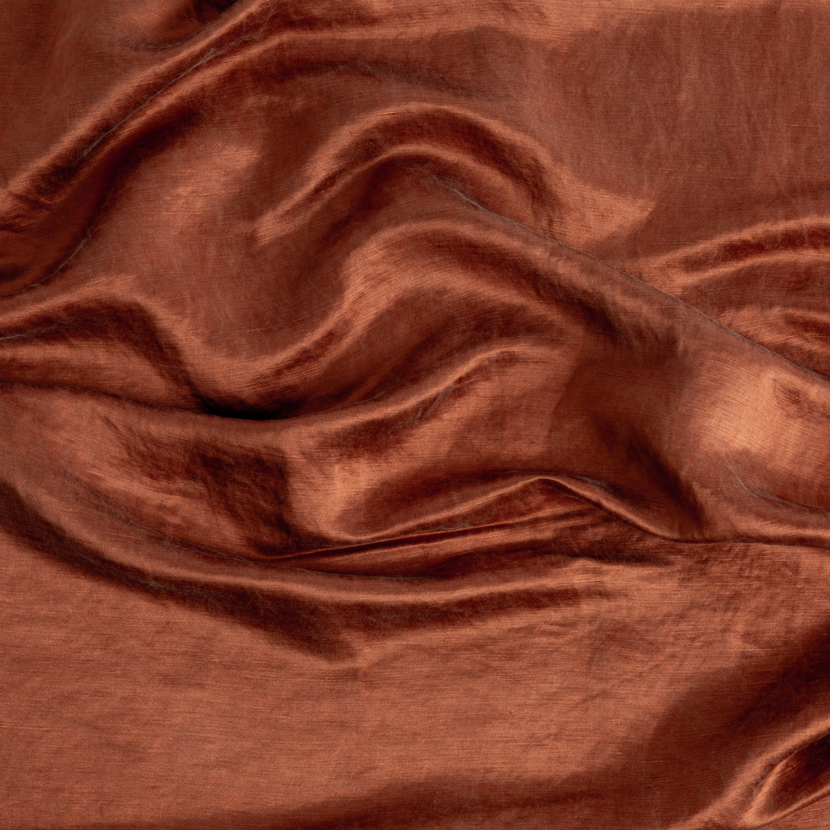Close-up of Bella Notte Taline sham in Autumn, showing draped linen-silk fabric with warm sheen.