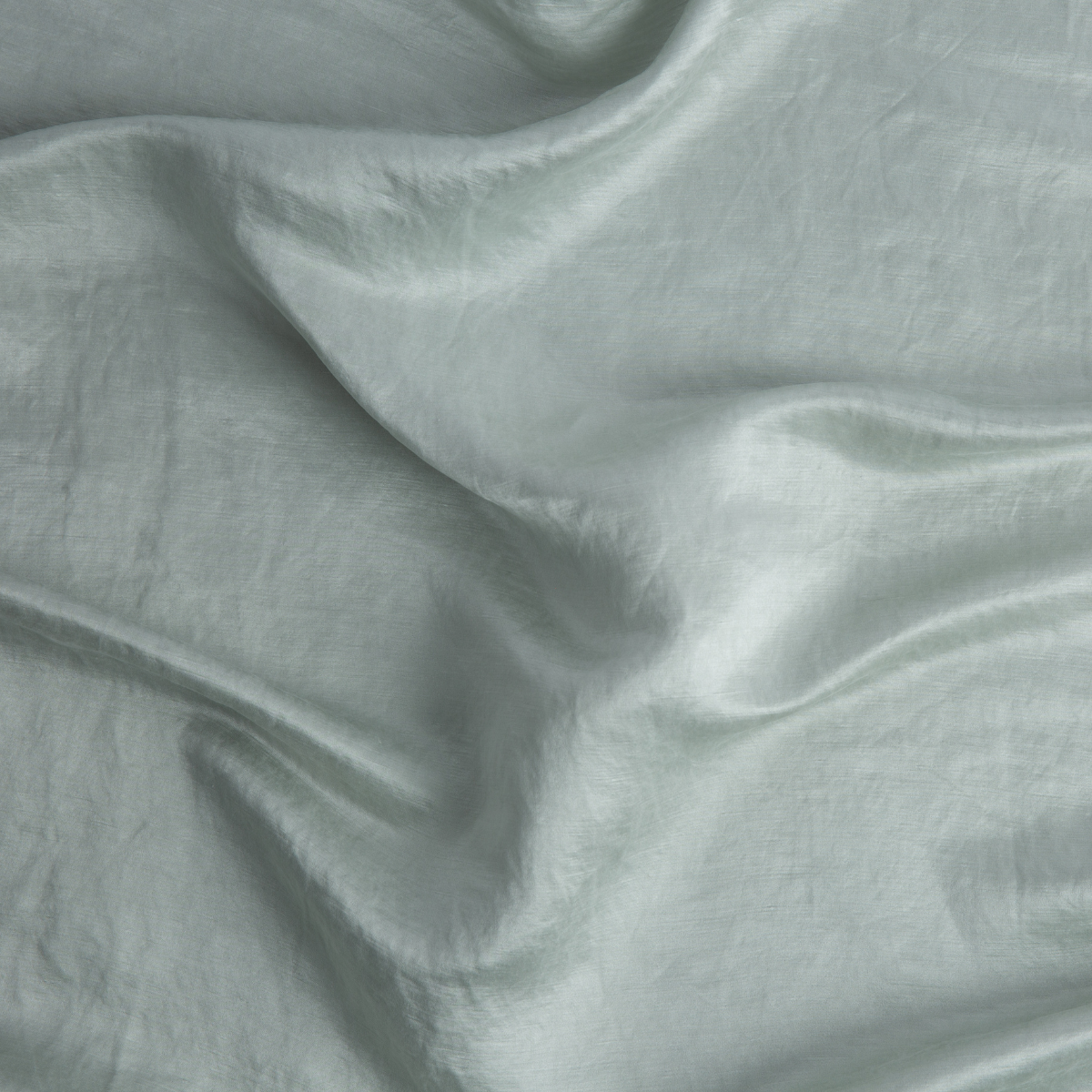 Close-up of Cloud Bella Notte Paloma sham fabric showing soft sheen and relaxed drape.