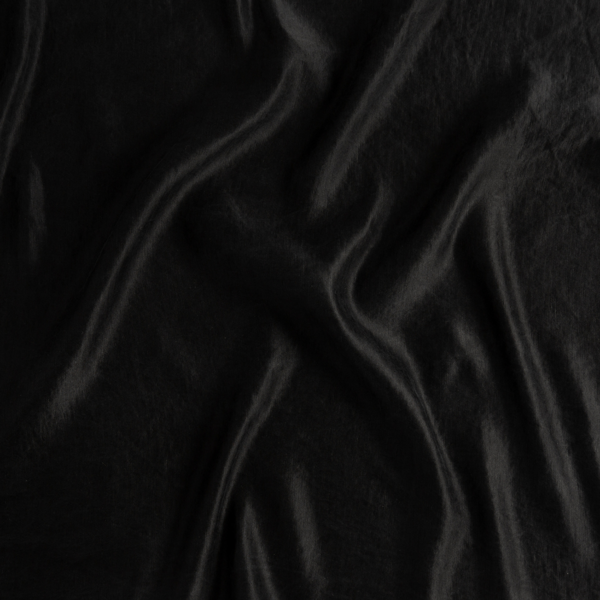 Close-up of Bella Notte Paloma bed skirt in Corvino, showing draped silky fabric sheen.