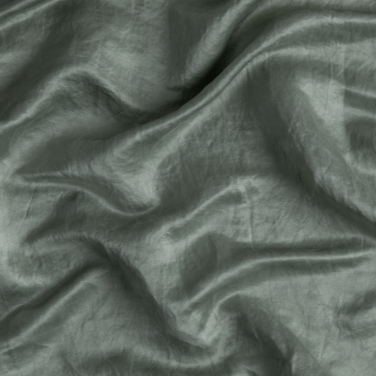 Close-up of Eucalyptus Paloma pillowcase fabric showing soft drape and subtle sheen.