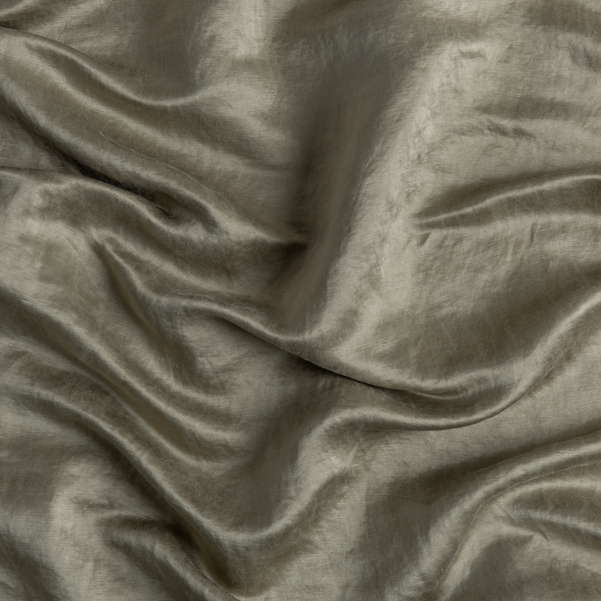 Close-up of Bella Notte Paloma pillowcase in Fog, showing lustrous draped fabric with soft sheen.
