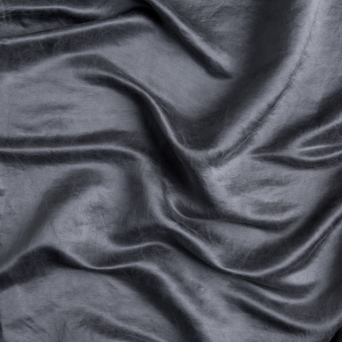 Close-up of draped French Lavender Paloma fabric showing smooth, lustrous texture and soft folds.