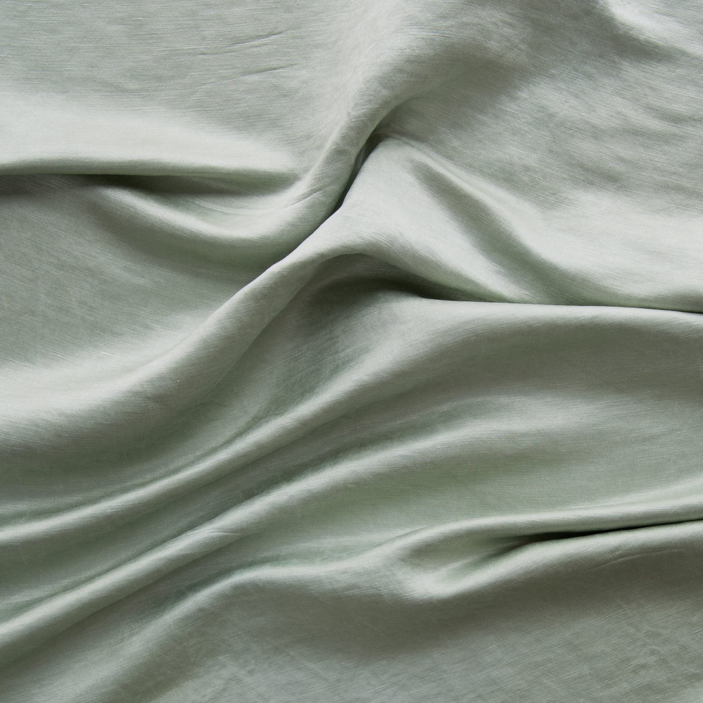 Close-up of Eucalyptus Bella Notte Paloma fabric showing soft drape and subtle sheen.