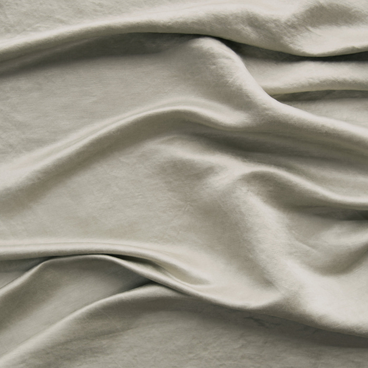 Close-up of Bella Notte Paloma fabric in Fog, showing soft drape and matte linen texture.