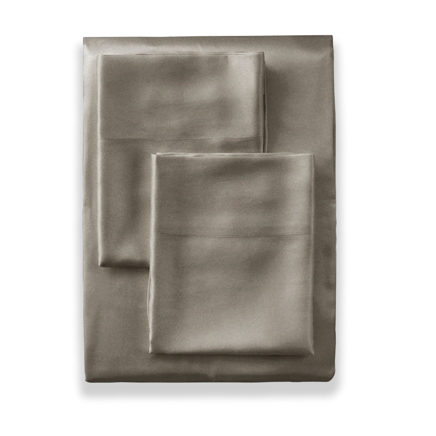 Close-up of folded taupe charmeuse sham set with subtle satin sheen on white background.