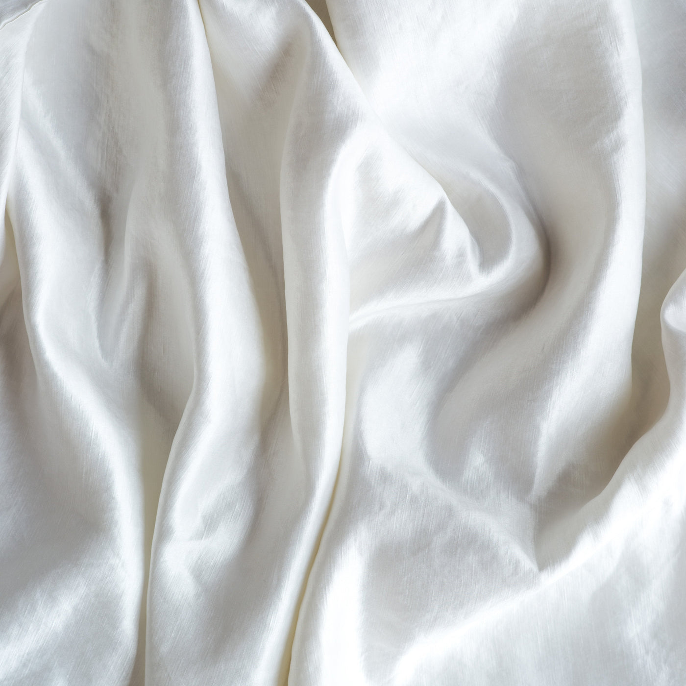 Bella Notte Paloma sham in White, softly draped linen fabric with gentle folds.