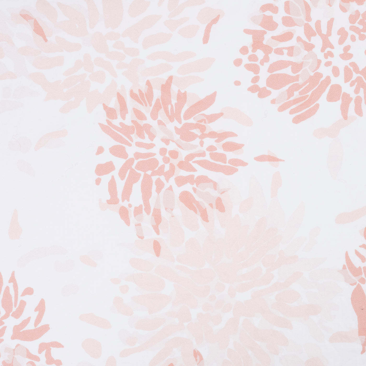 Close-up of blush chrysanthemum print on white cotton fabric.