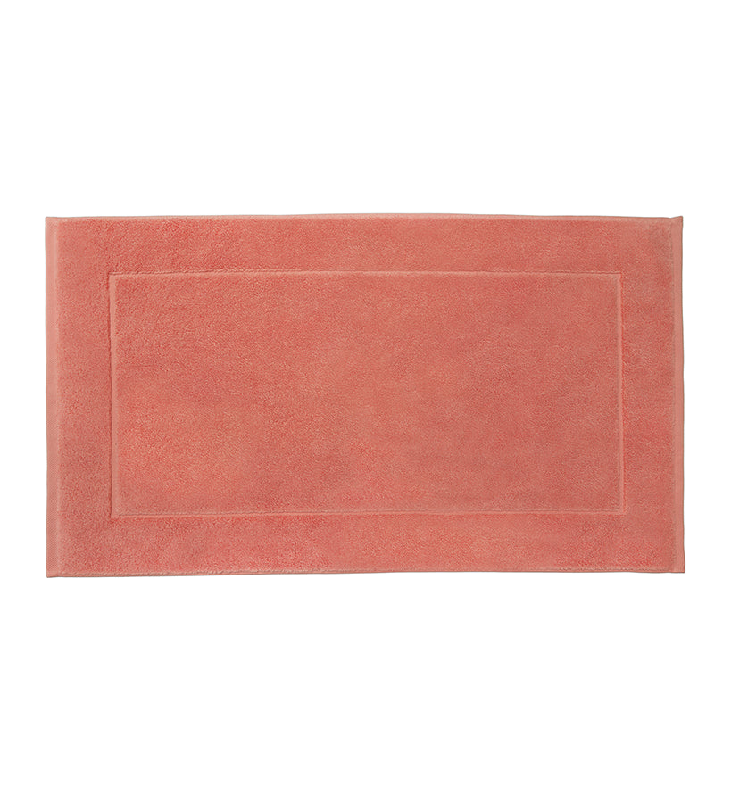 Sferra Cielo tub mat in terracotta cotton terry with tonal border detail.