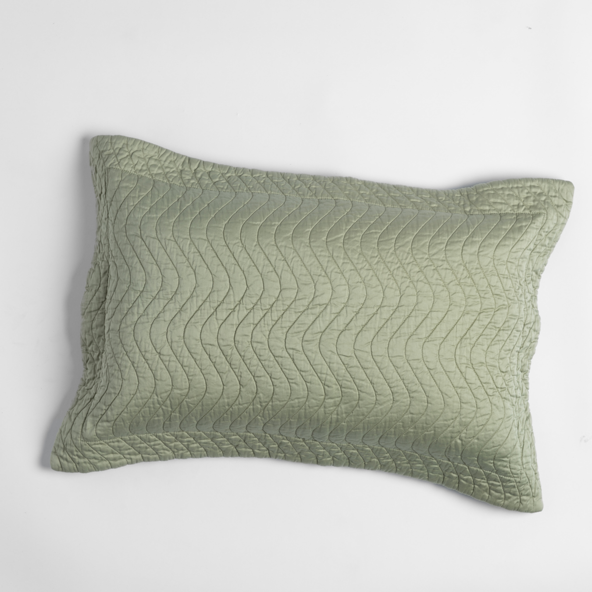 Cirillo throw pillow close-up showing wavy quilted stitching in Desert Sage.