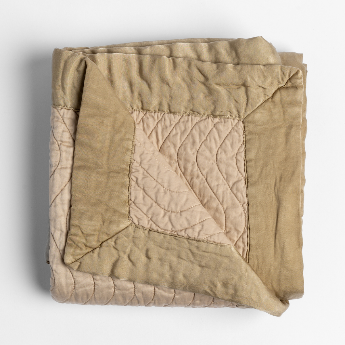 Bella Notte Cirillo blanket folded, showing Honeycomb reversible quilted linen with leaf stitch detail.