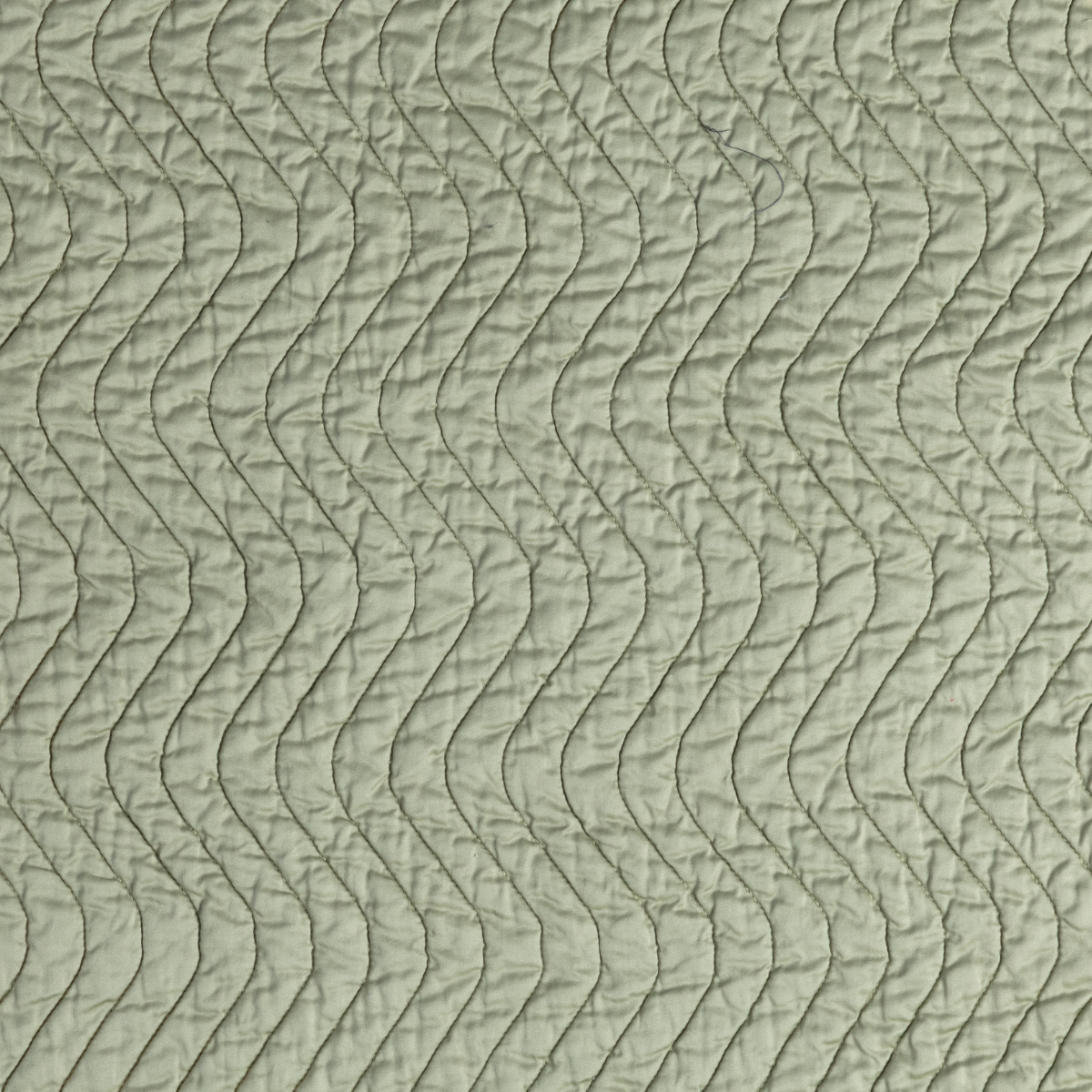 Close-up of Desert Sage Cirillo sham showing wave-quilted texture in soft sage fabric.