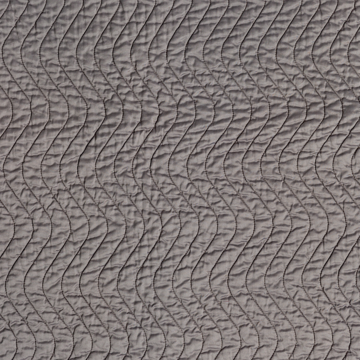 Close-up of French Lavender quilted throw with wave-stitched texture detail.