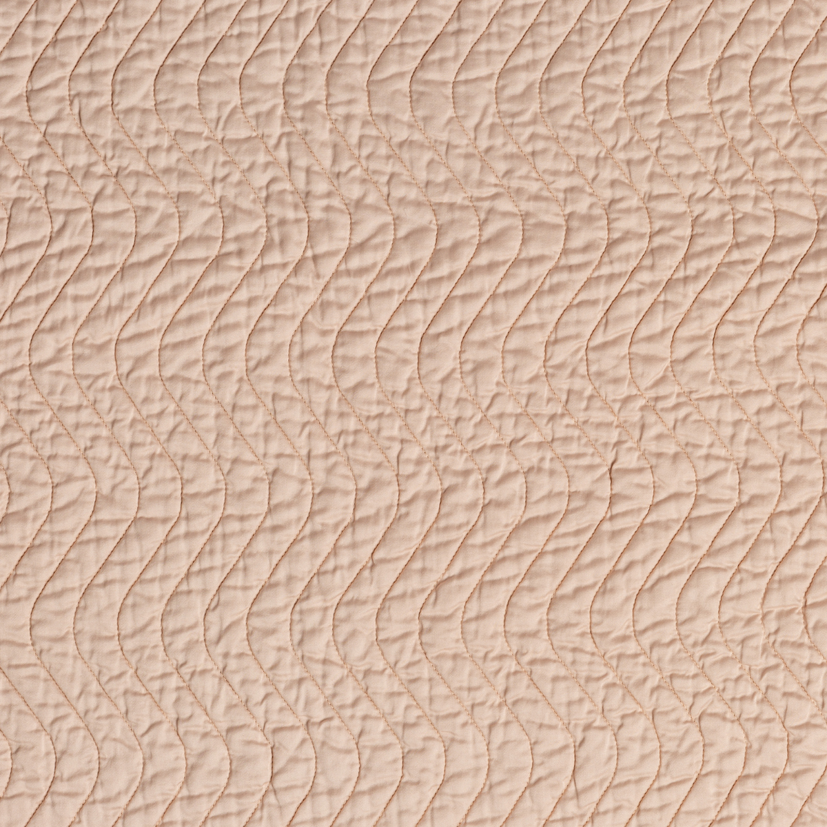 Close-up of Pearl Bella Notte Cirillo coverlet showing wave-pattern quilting texture.