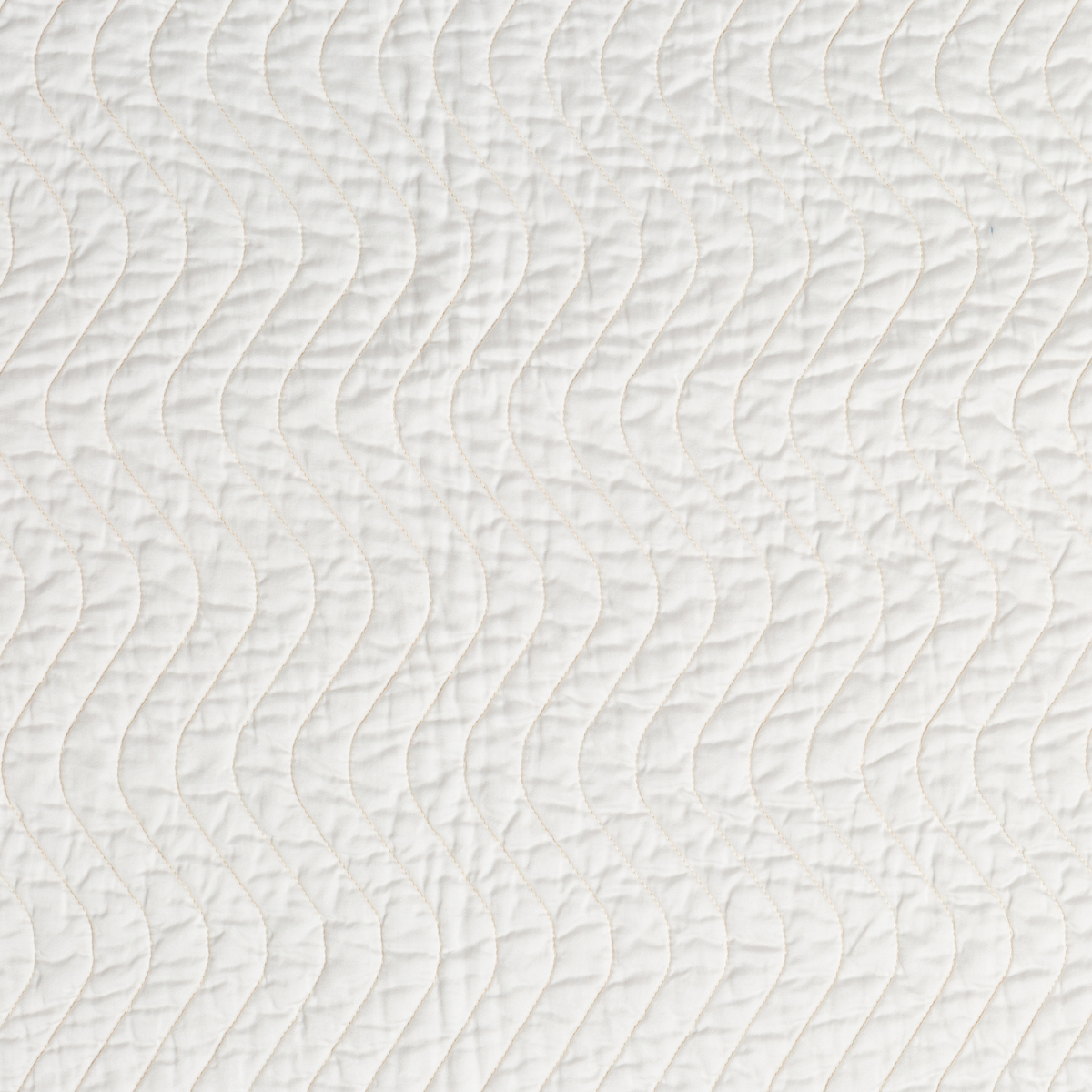 Close-up of Winter White quilted wave stitching on Bella Notte Cirillo throw pillow.