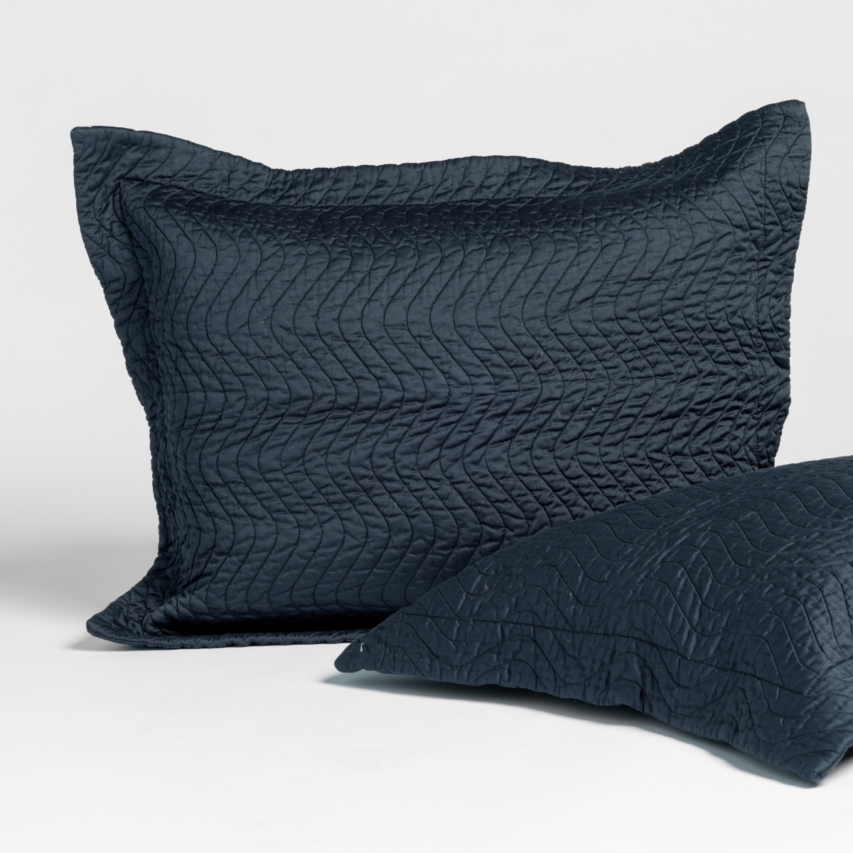 Bella Notte Cirillo sham in Slate, showing quilted leaf-pattern texture on two pillow sizes.