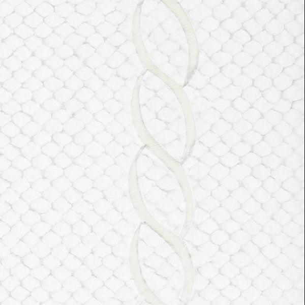 Close-up of ivory embroidered chain border detail on a white textured tub mat.