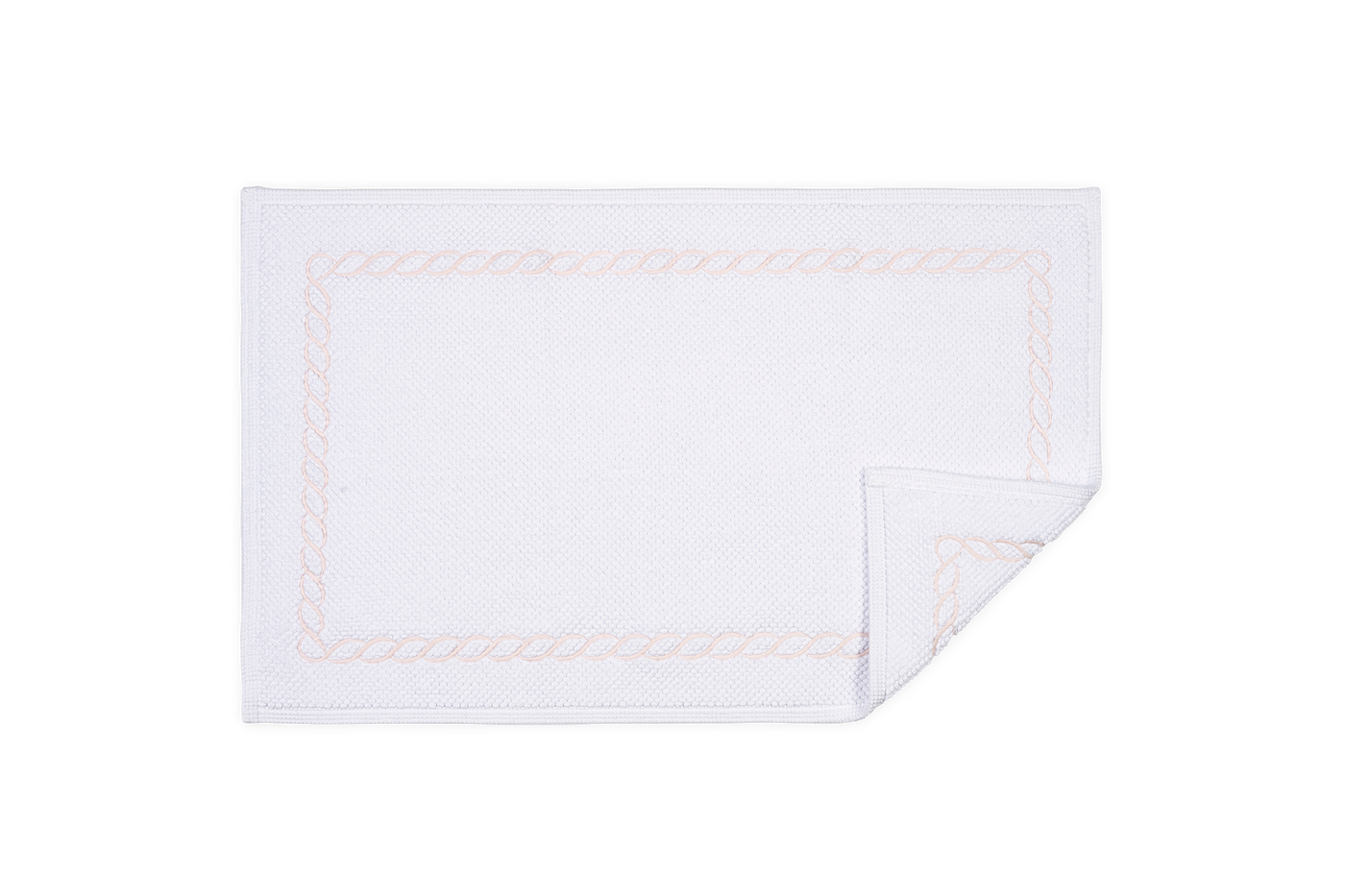 Corner detail of Matouk Classic Chain tub mat showing champagne embroidered border.