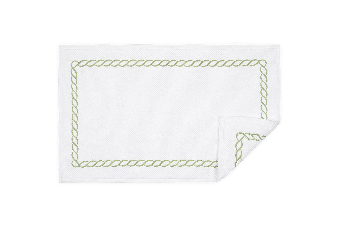 Corner detail of Matouk Classic Chain tub mat with sage rope embroidery border.