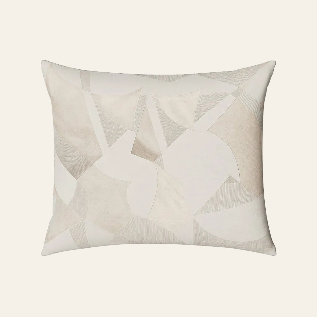 Ann Gish Clio pillow in ivory with tonal geometric patchwork appliqué design.