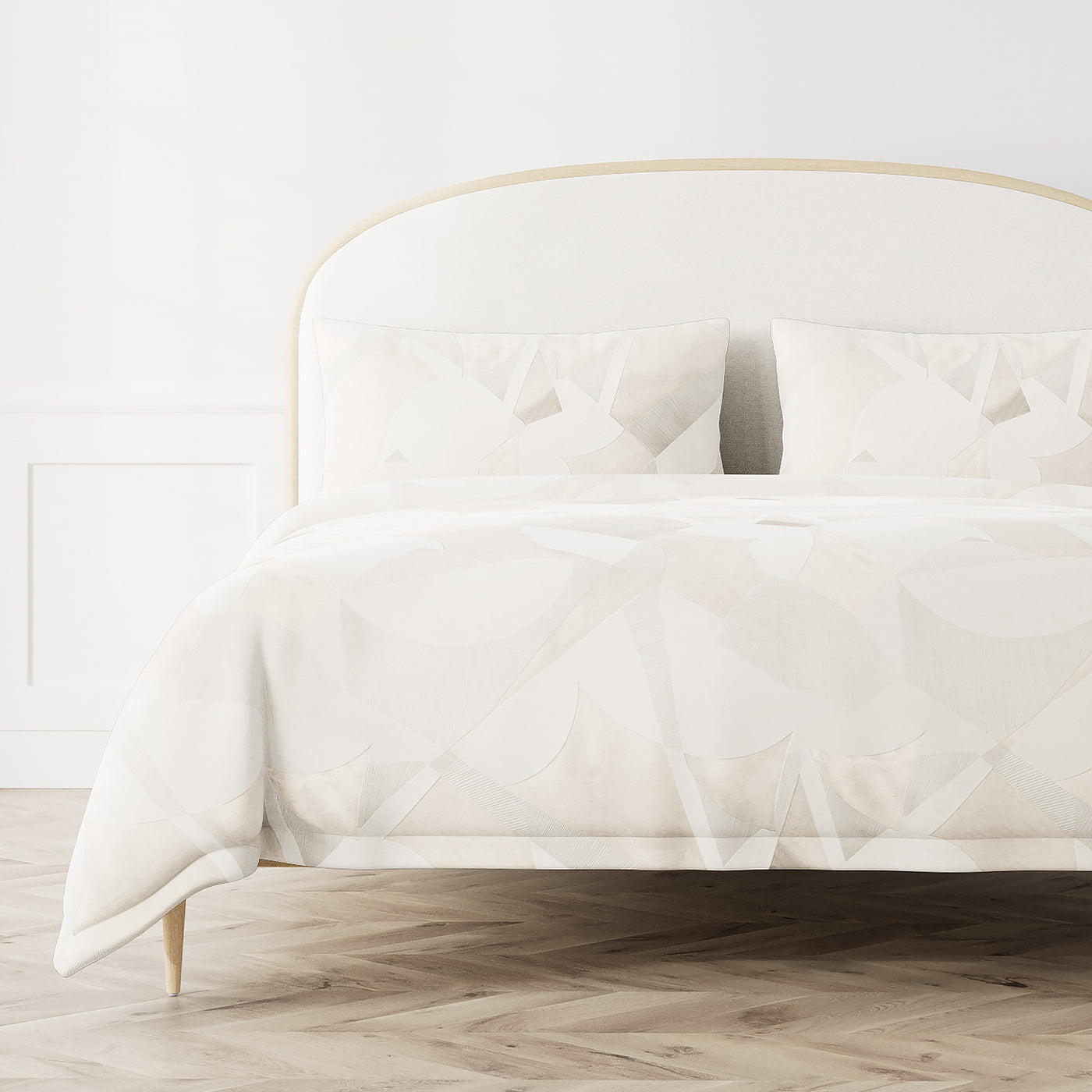 Ann Gish Clio duvet cover in ivory with geometric triangle pattern on styled bed.