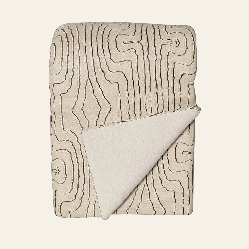 Ann Gish Contour throw in ivory with dark contour line pattern, folded to show plain reverse.