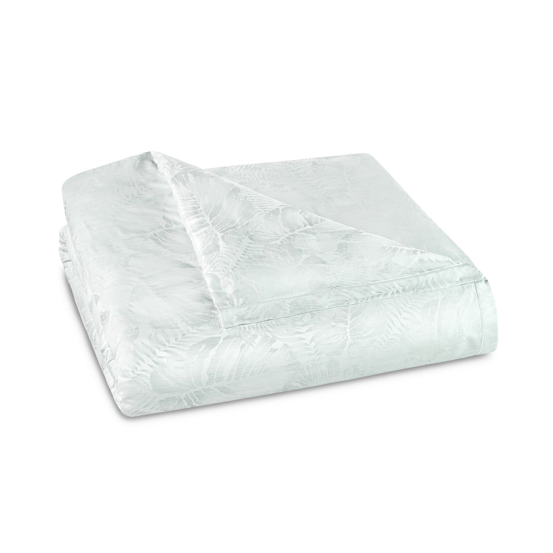 Amalia Home Collection Copacabana duvet cover folded in mint with tone-on-tone leaf jacquard.