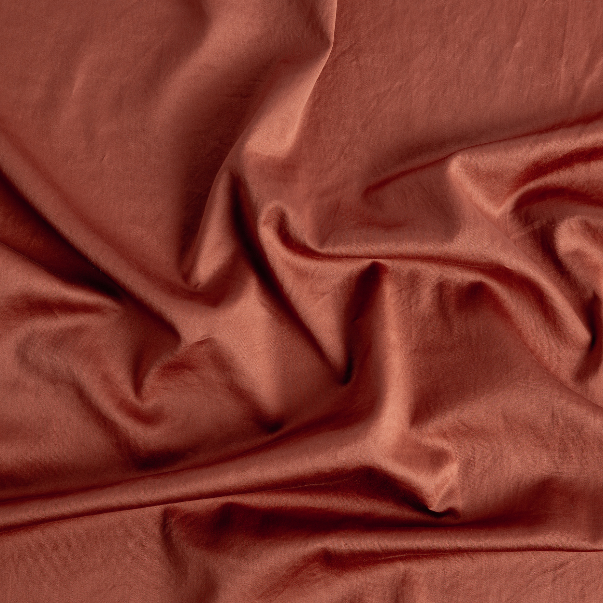 Softly draped Autumn linen fabric showing natural folds and sheen.
