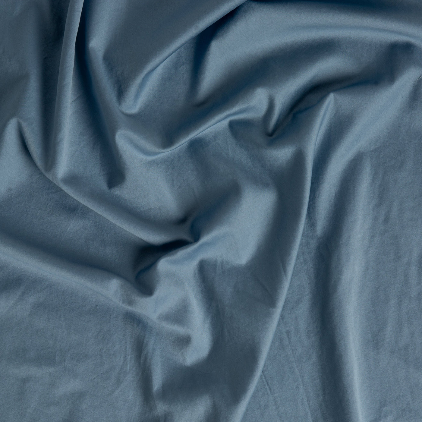 Close-up of Bella Notte Bria pillowcase fabric in Tahoe Blue, showing smooth draped texture.
