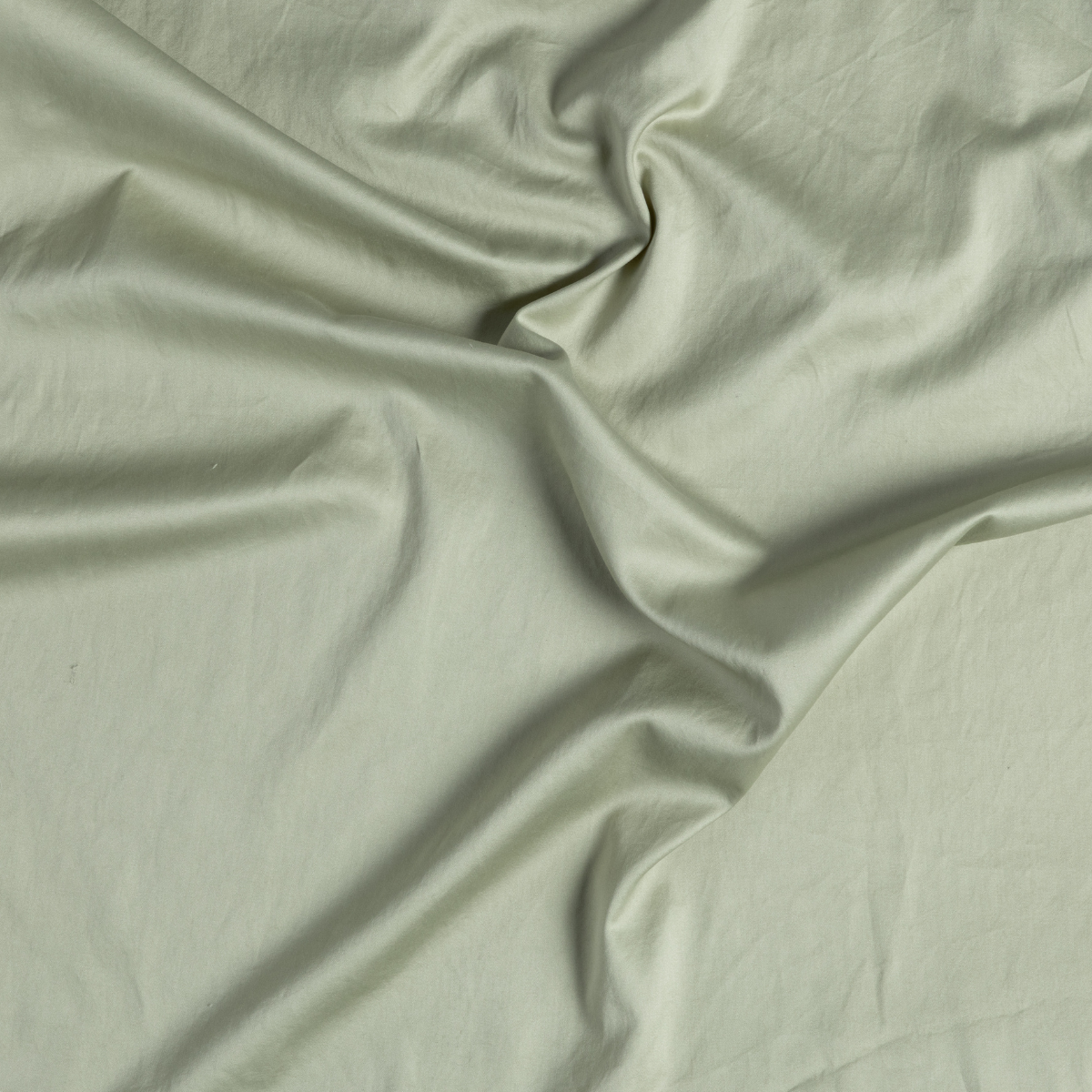 Softly draped Desert Sage cotton fabric showing smooth weave and gentle folds.
