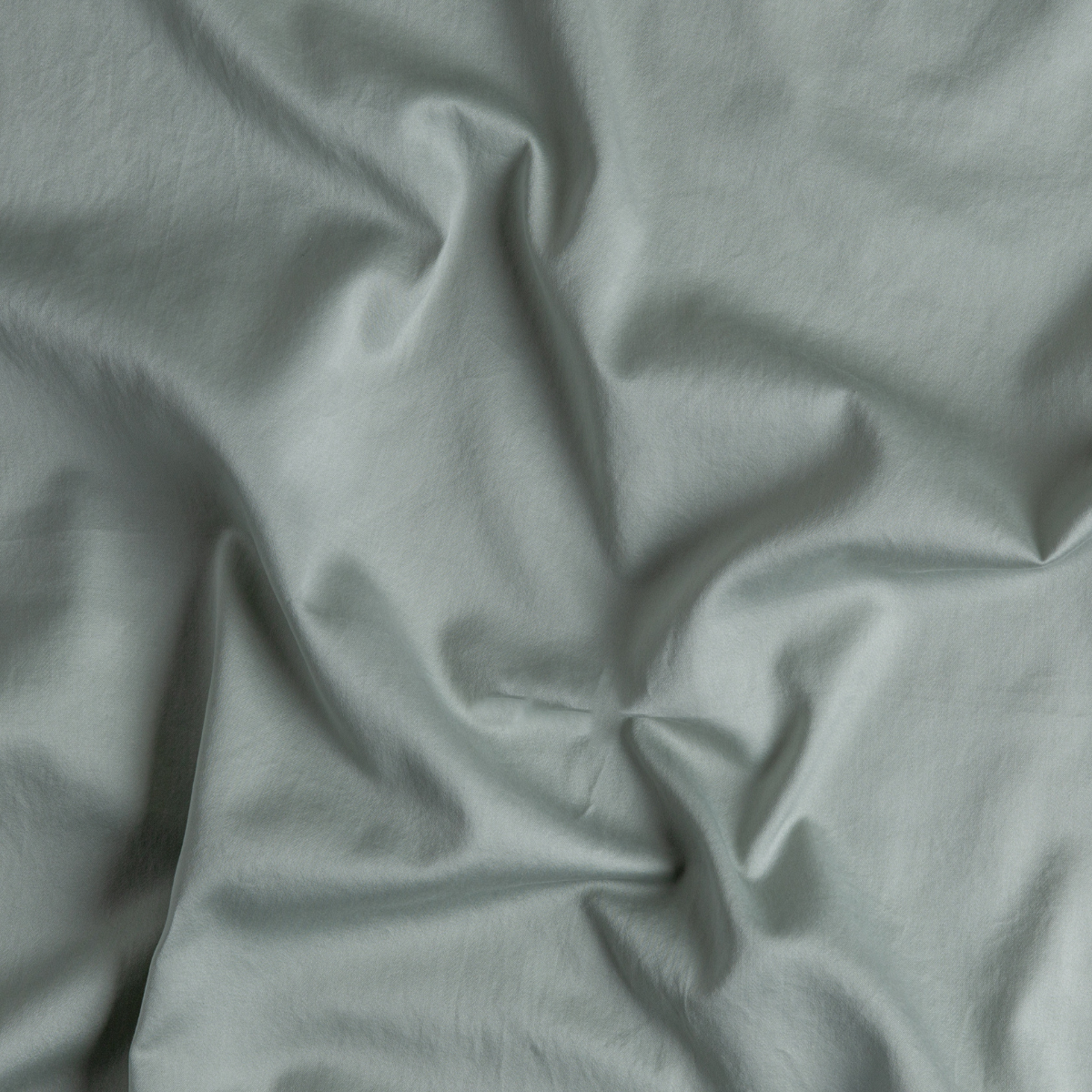 Close-up of Eucalyptus Bella Notte Bria flat sheet fabric, showing soft drape and texture.