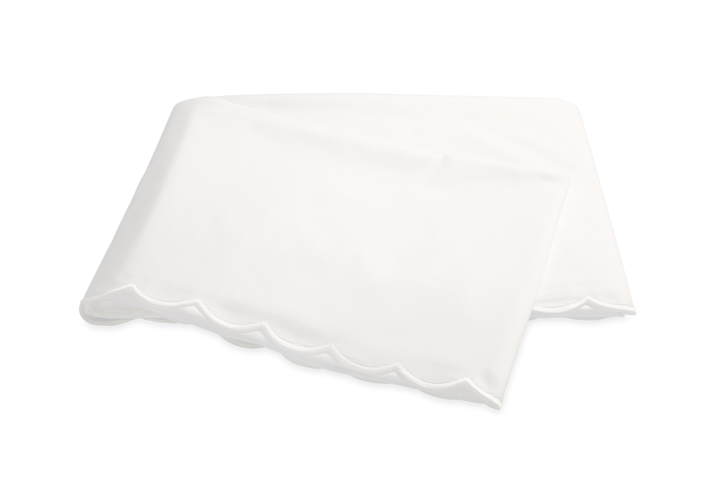 Scalloped hem detail on crisp white cotton flat sheet.