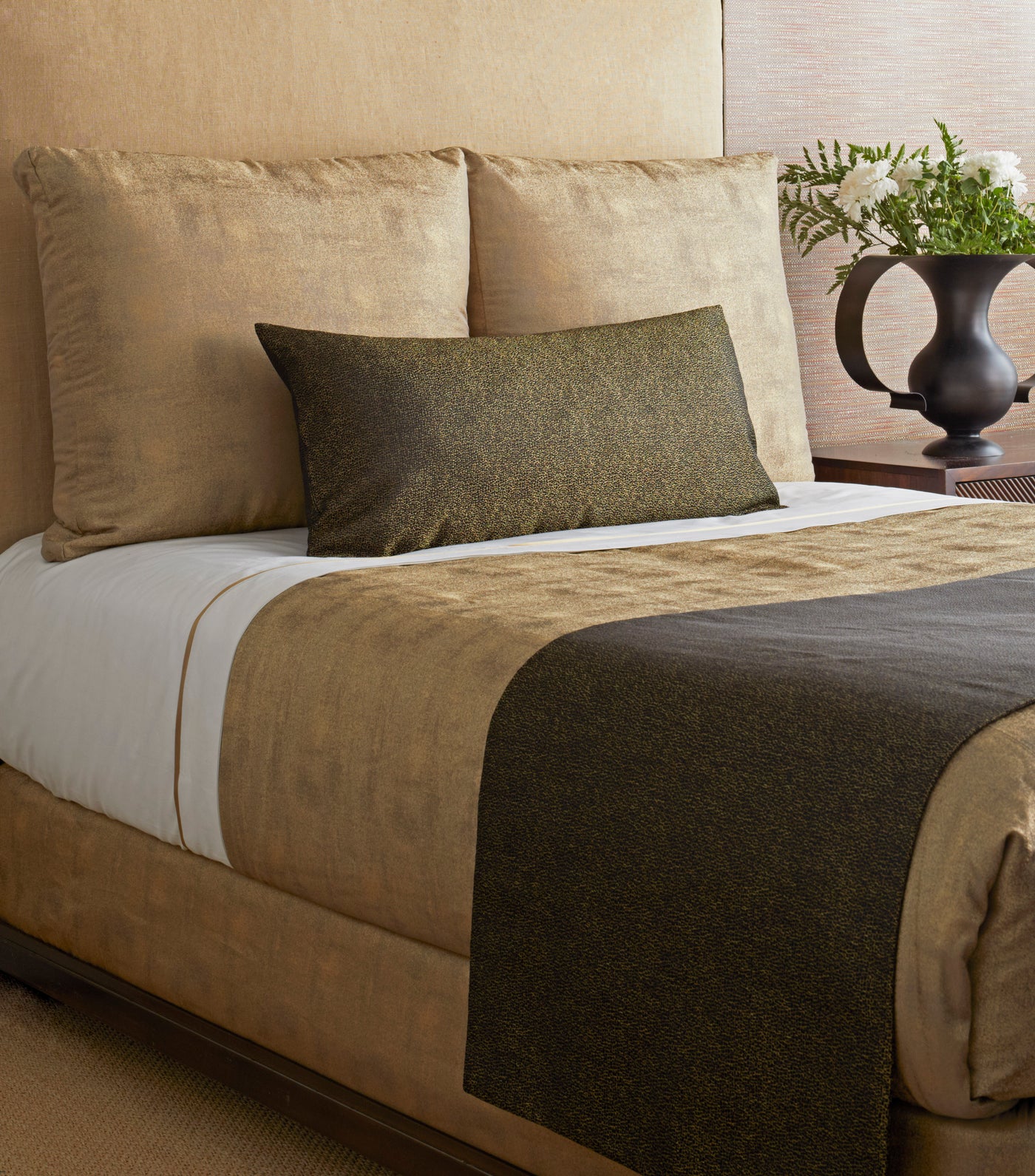 Ann Gish Dapple bed finisher in olive, styled across foot of bed with matching lumbar pillow.