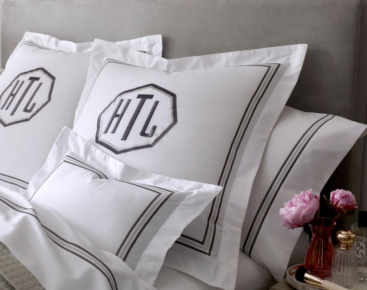 Close-up of Home Treasures Delancey white cotton with charcoal double-border detail.